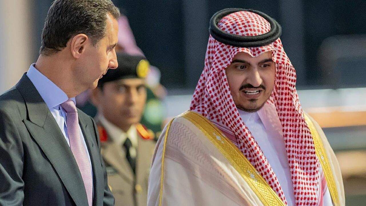 Syrian President Bashar al-Assad is welcomed by Mecca deputy governor Prince Badr bin Sultan as he arrives in the Saudi city of Jeddah for his first Arab summit in more than a decade of war