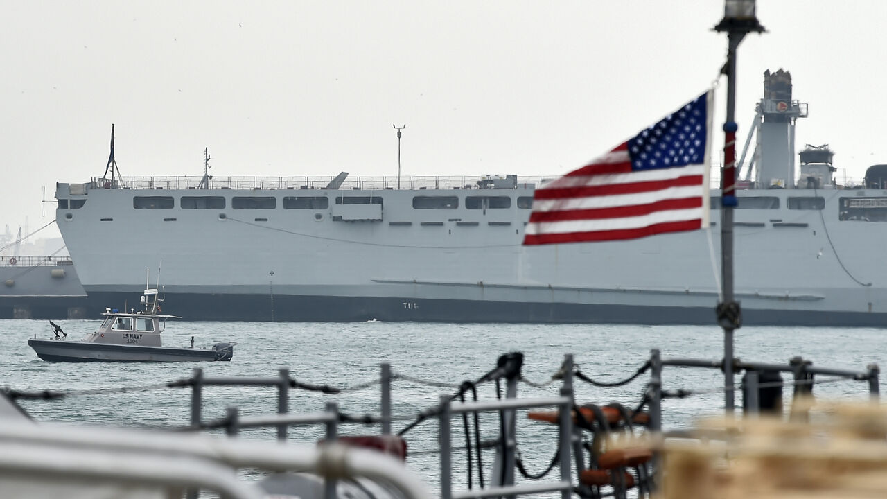 A US Navy patrol ship guards US and coalitions ships docked at the US 5th Fleet Command in Bahrain's capital Manama on Dec. 17, 2019. 