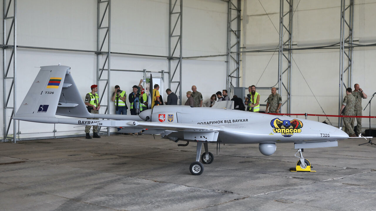 A Turkish Bayraktar TB2 combat drone is on view during a presentation at the Lithuanian Air Force Base in Siauliai, Lithuania, on July 6, 2022.