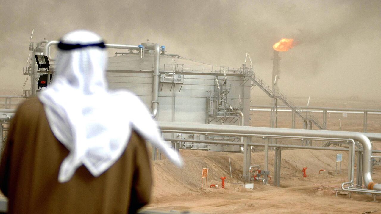 An employee of the Kuwait Oil Company (KOC) looks at 25 January 2005 the Gathering Center No.15 of al-Rawdatain field, 100 kms north of Kuwait City, following its inauguration just three years after coming under explosion. The KOC affiliated center came under fire by the eve of 2002 due to an oil leakage from the main pipe that protrudes from the Center. According to the emergency plan the center was immediately suspended from action. The oil leakage that reached the gas boosting station 130 and neighbourin