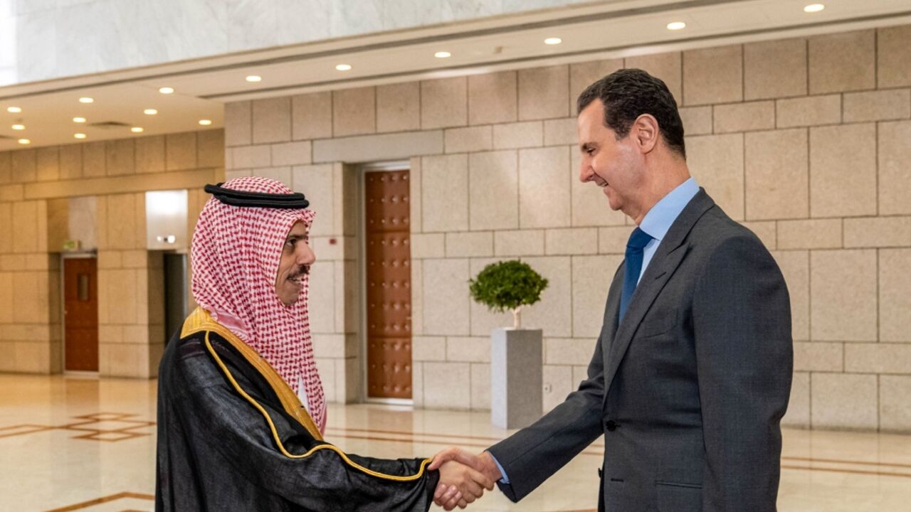 Syria's President Bashar al-Assad (R) received Saudi Arabia's Foreign Minister Faisal bin Farhan in Damascus last month