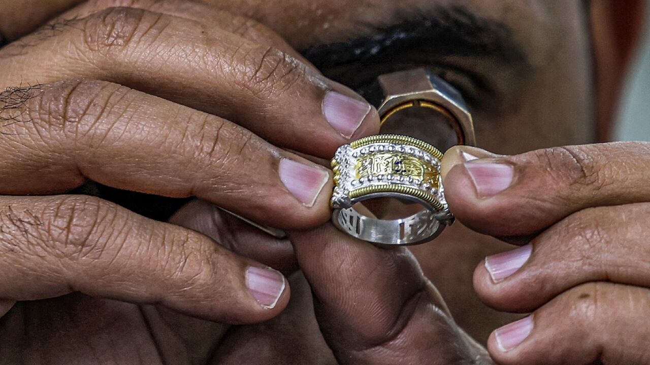 A craftsman inspects a jewellery piece at the Azza Fahmy workshop in the 6th of October industrial zone southwest of Egypt's capital