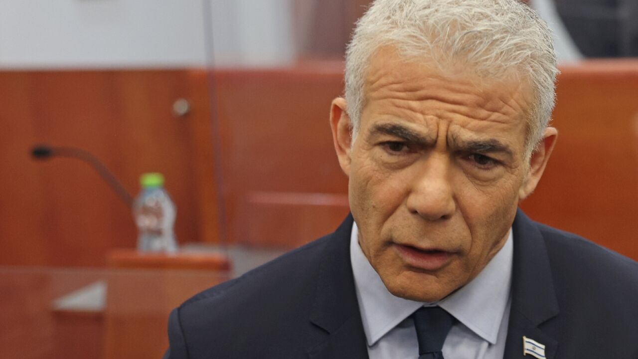 Former Israeli premier and opposition leader Yair Lapid arrived at court to testify