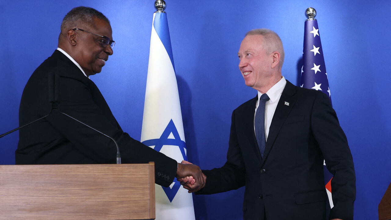 Israeli Minister of Defence Yoav Gallant (R) and US Secretary of Defense Lloyd Austin shake hands after delivering a statement to the press at the Israel Aerospace Industries (IAI) headquarters near the Ben Gurion airport in Tel Aviv, on March 9, 2023. 