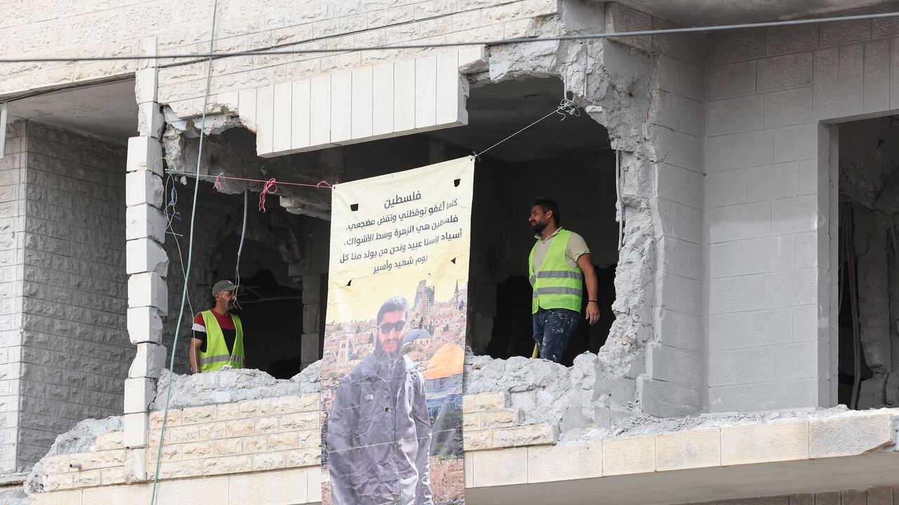 Palestinian municipality workers inspect the damage to the house of Islam Faroukh, a Palestinian charged for the Jerusalem twin bombings in November 2022 that killed two people, after it was demolished by Israeli forces in Ramallah in the occupied West Bank on June 8, 2023. (Photo by AHMAD GHARABLI / AFP) (Photo by AHMAD GHARABLI/AFP via Getty Images)