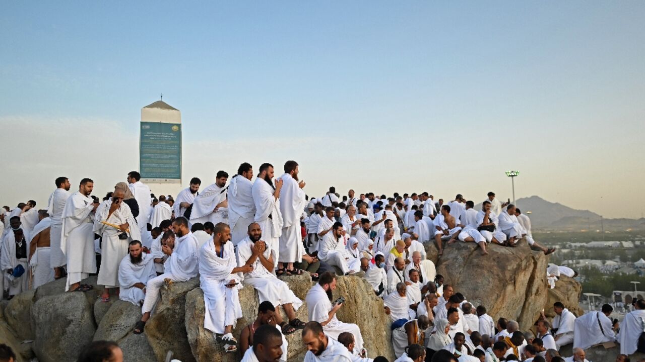 Muslim pilgrims pray atop Saudi Arabia's Mount Arafat, also known as Jabal al-Rahma or Mount of Mercy, during the climax of the Hajj pilgrimage