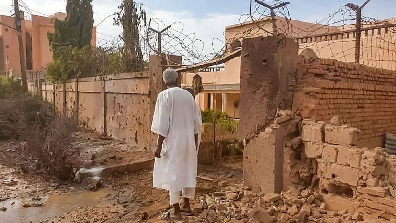 A man walks through rubble after clashes and bombardment on the western outskirts of Omdurman, the twin city of Sudan's capital, on July 4, 2023