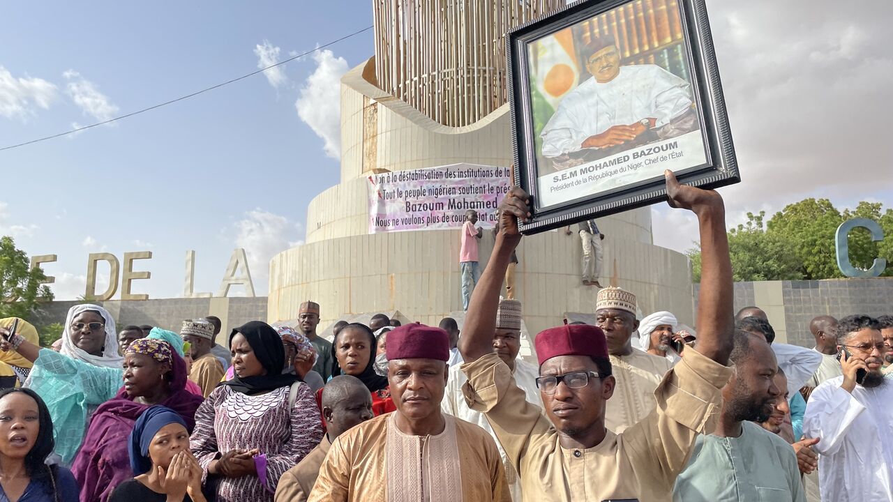 Supporters of Nigerien President Mohamed Bazoum gather to show their support for him in Niamey on July 26, 2023. 
