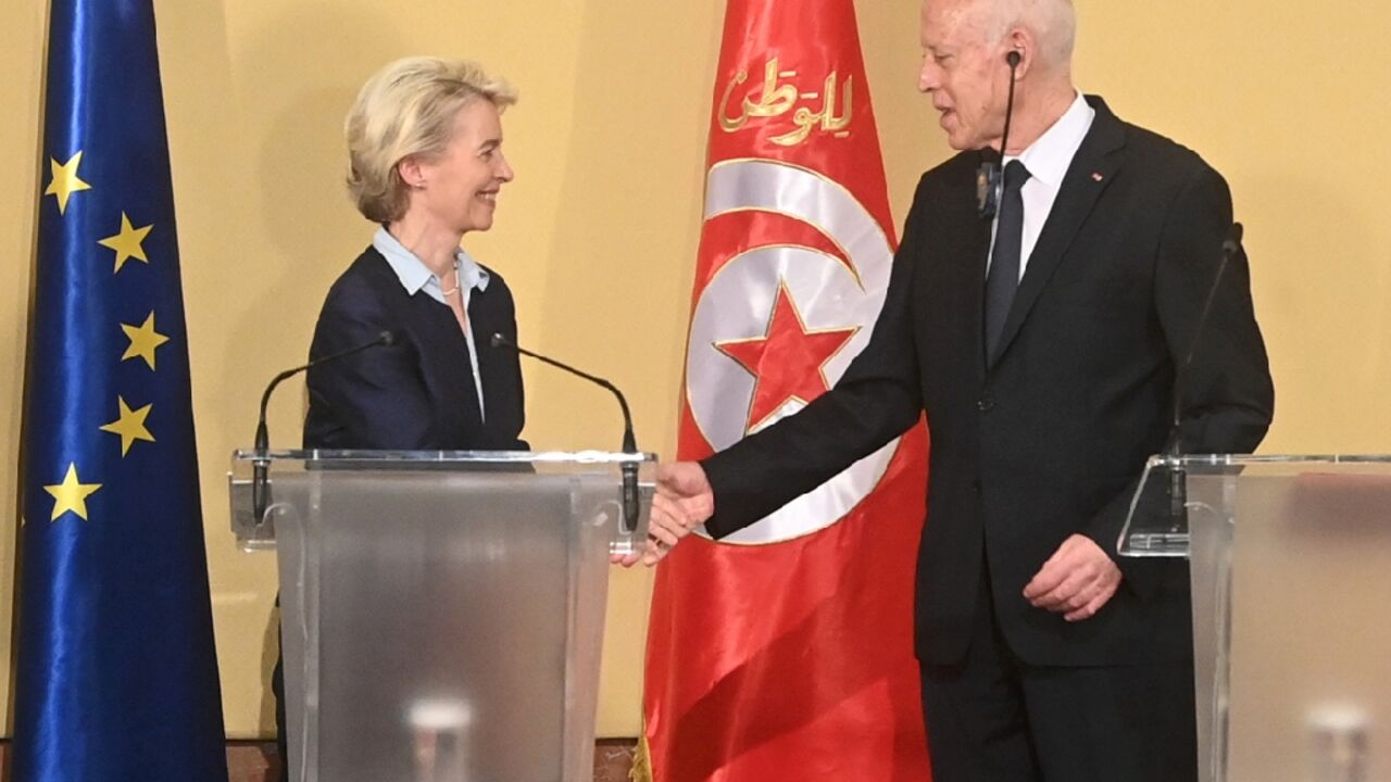 European Commission chief  Ursula Von der Leyen shakes hands with Tunisian President Kais Saied after announcing a strategic deal with Tunis on economic development and irregular migration