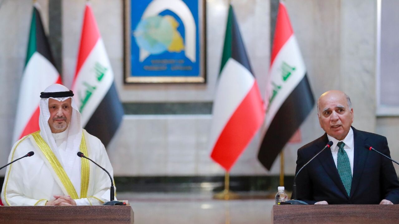 The foreign ministers of Kuwait (L) and Iraq give a press conference in Baghdad