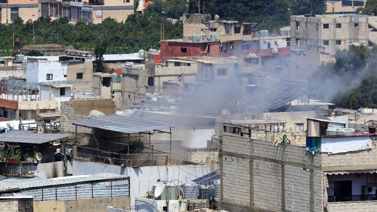 Smoke billows during inside Ain al-Helweh Palestinian refugee camp in the Lebanese coastal city of Sidon