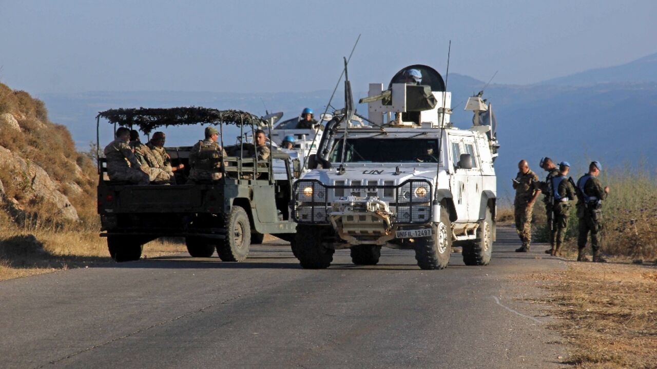Lebanese army troops and United Nations Interim Forces in Lebanon (UNIFIL) peacekeepers patrol along the Lebanon-Israel border in the southern town of Kfar Kila