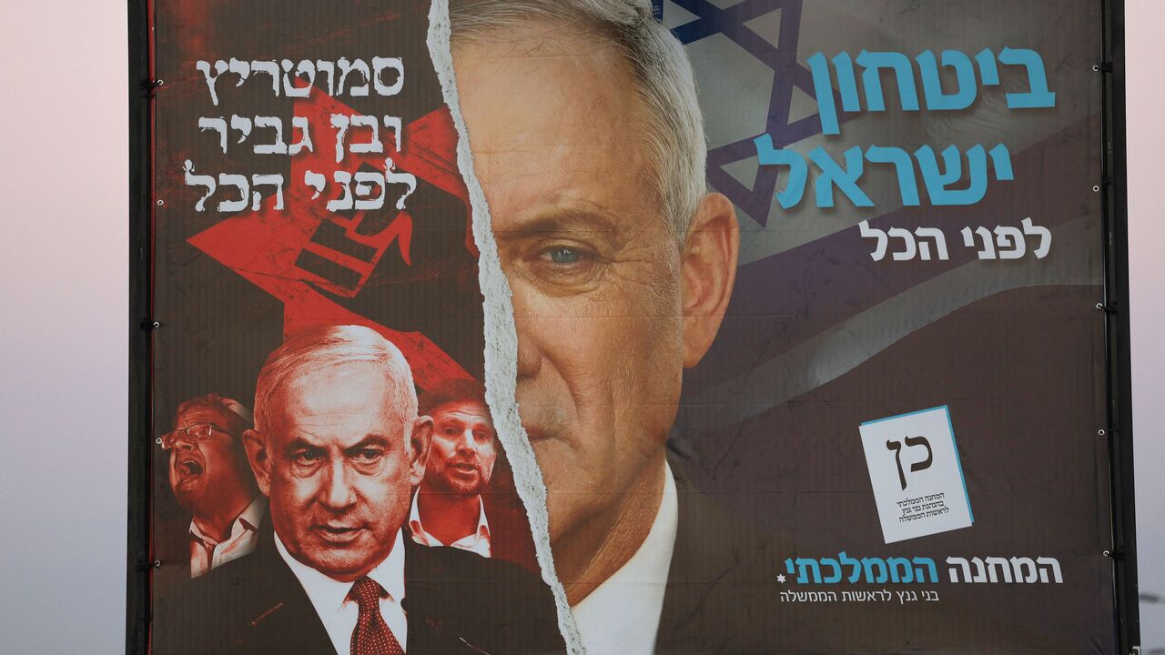 A picture shows a electoral banner for Israel's National Unity bloc, which includes the Blue and White (Kahol Lavan) led by Defence Minister Benny Gantz (R), and a portrait of Likud party leader Benjamin Netanyahu (L), in Tel Aviv on October 27, 2022, ahead of the November general elections. (Photo by AHMAD GHARABLI / AFP) (Photo by AHMAD GHARABLI/AFP via Getty Images)