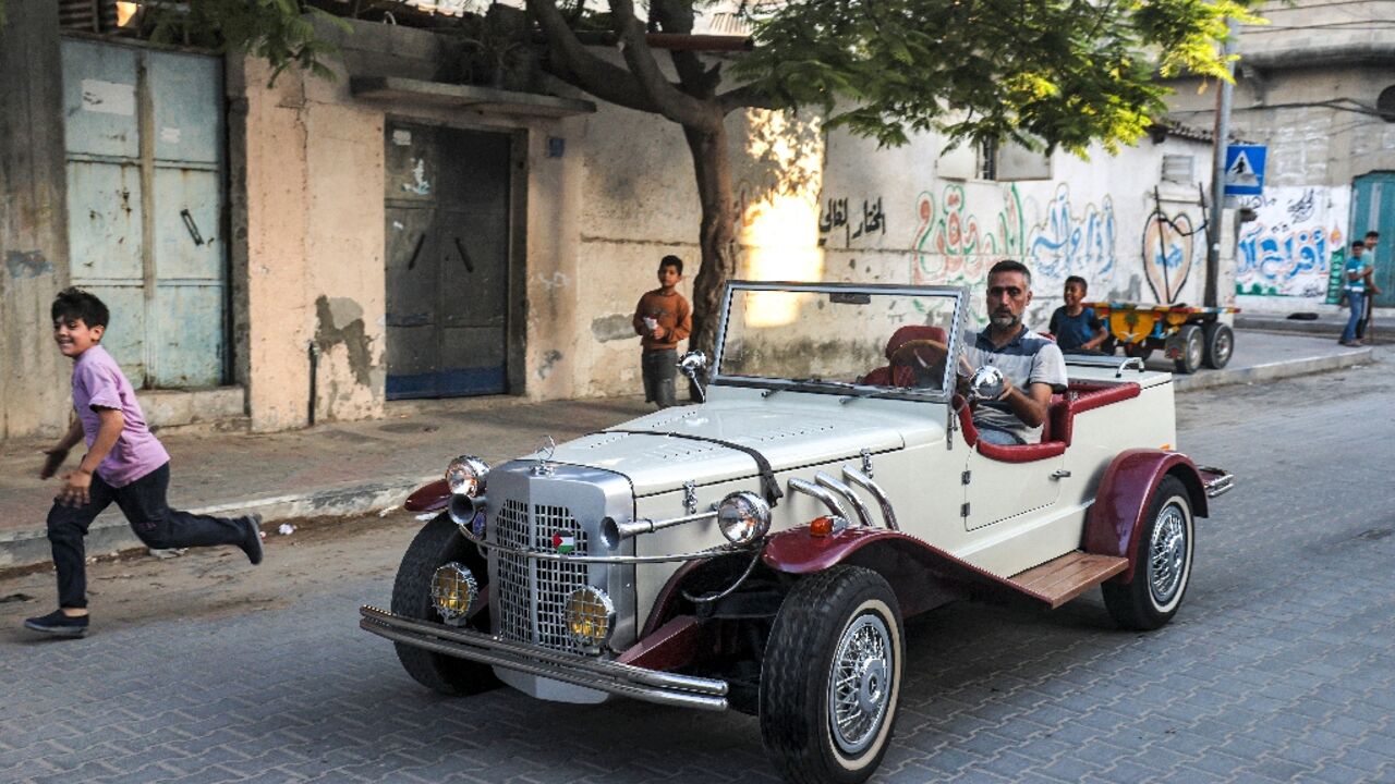 Munir al-Shandi drives his Gazelle down a Gaza street