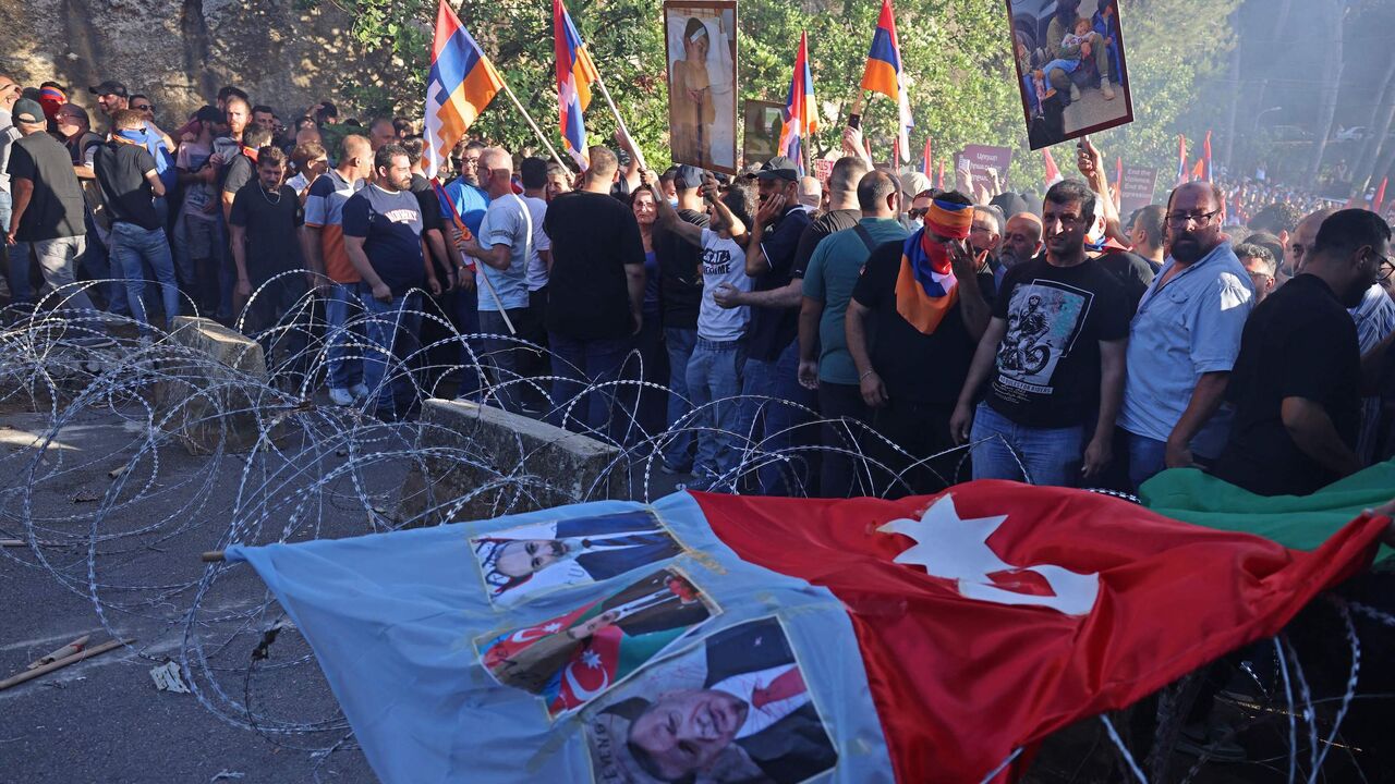 Lebanese Armenians gather during a demonstration outside the Azerbaijani embassy in Ain Aar to denounce Azerbaijan's reintegration of Nagorno-Karabakh, Sept. 28, 2023.