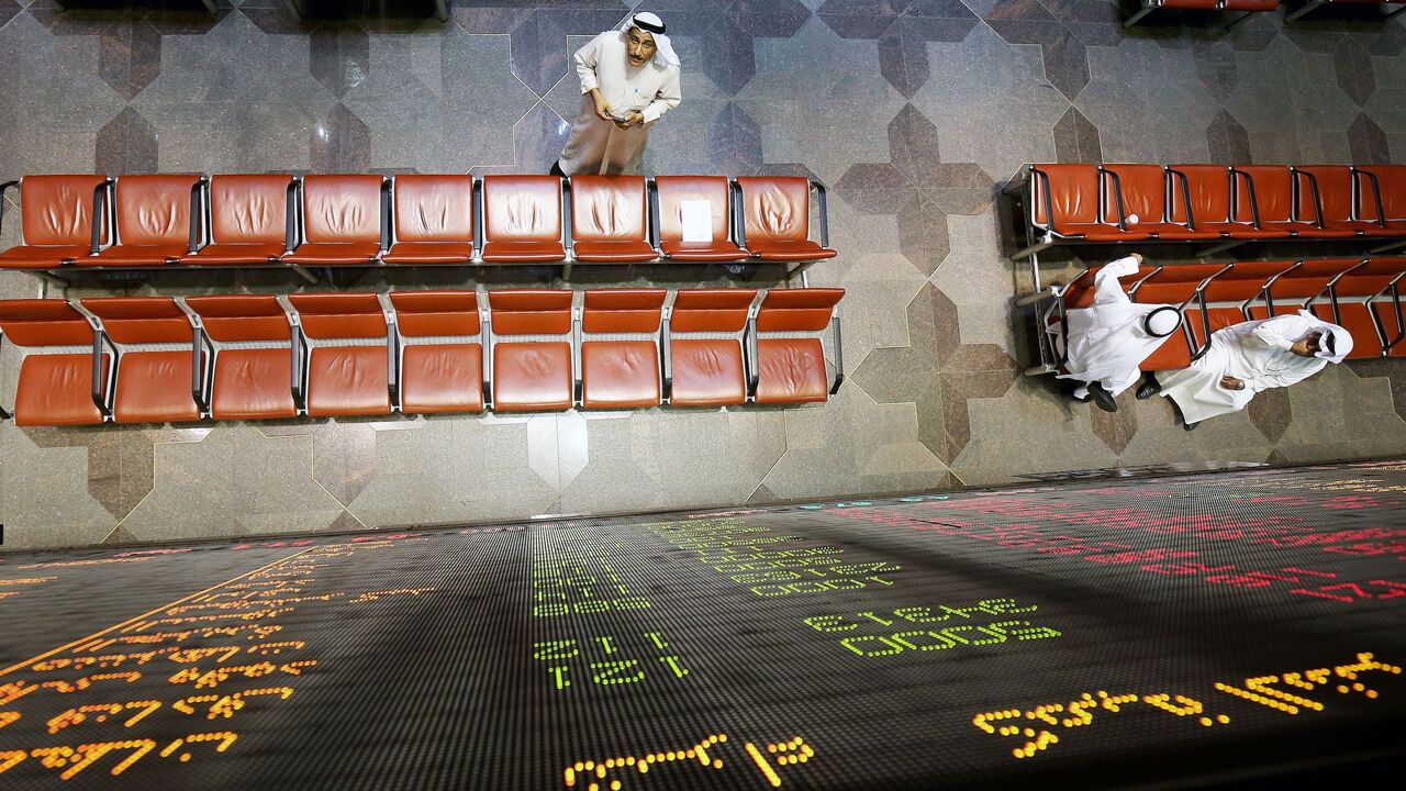 Kuwaiti traders follow the market's movement at the Stock Exchange, Kuwait City, March 8, 2018.