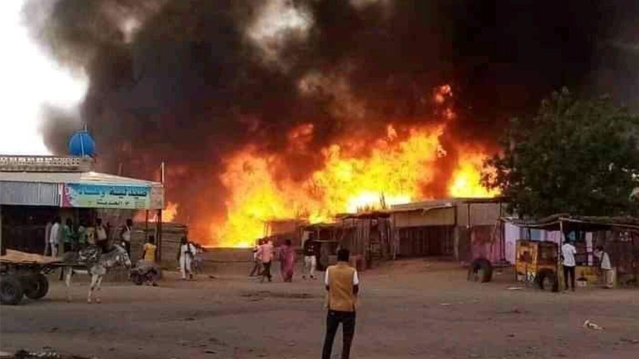 Fire rages at a livestock market area in El Fasher, the capital of Sudan's North Darfur state, on September 1, 2023, in the aftermath of bombardment by the paramilitary Rapid Support Forces (RSF)