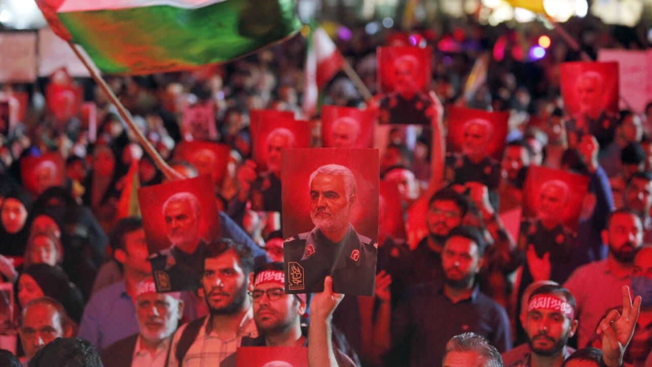 Pictures of slain Revolutionary Guards commander Qasem Soleimani at a rally in Tehran in solidarity with a Hamas offensive against Israel