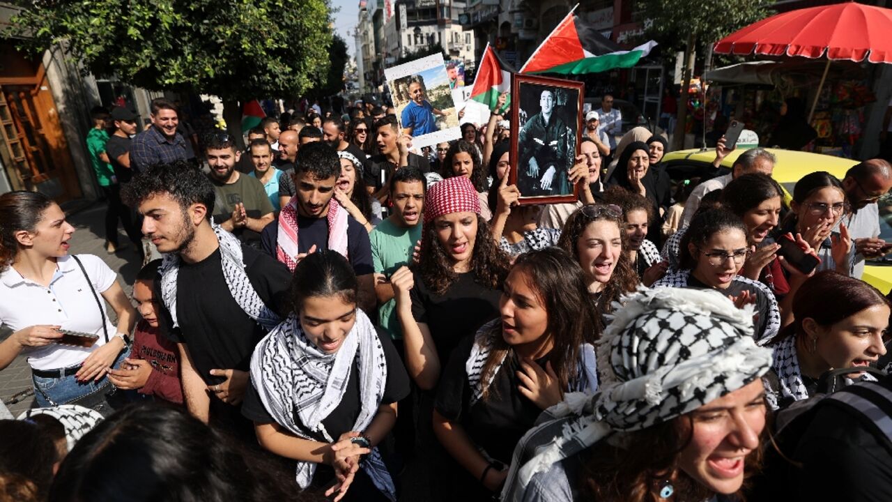 Relatives of Palestinian prisoners held in Israeli jails demonstrate in Ramallah to demand their release and to express solidarity with the people of the Gaza Strip