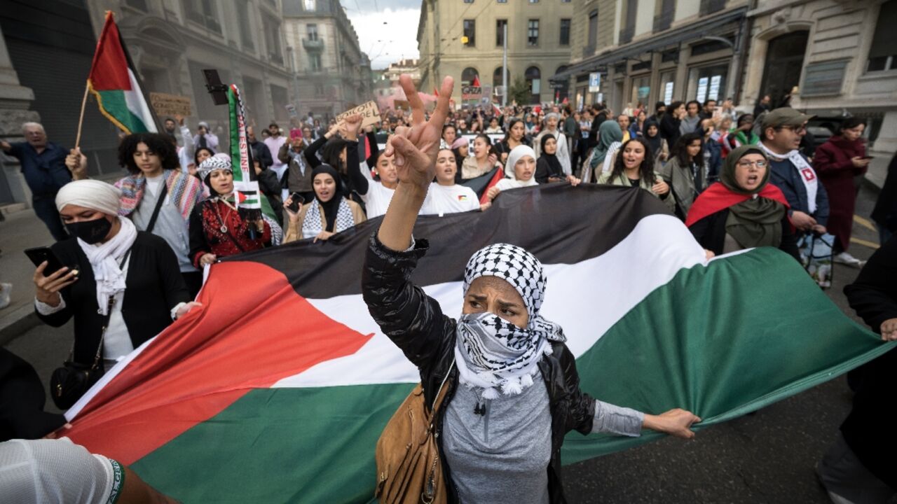 Demonstrators in Geneva carried a giant Palestinian flag during a pro-Palestinian rally in the city centre