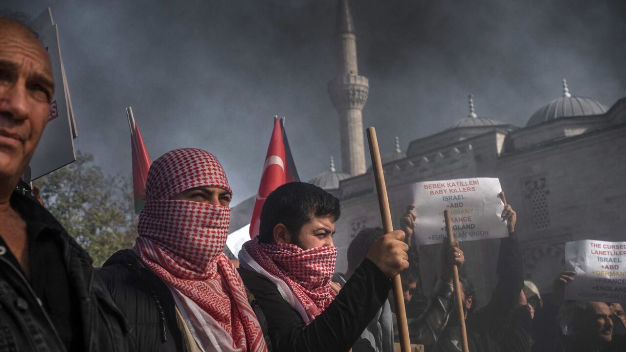 Protesters, some wearing a Keffiyeh, take part in a demonstration against Israel in Istanbul on October 20, 2023, after Turkey declared a three-day national mourning in solidarity with the Palestinian people. Israelis and Palestinians have traded blame for a deadly strike on a Gaza hospital this week, with the number of deaths given ranging from dozens to nearly 500. World leaders have condemned the strike and protests have erupted in Arab countries and the wider Muslim world amid stark disagreement over th