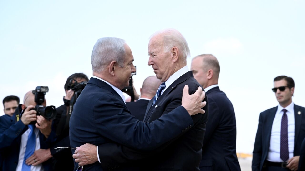 Israel Prime Minister Benjamin Netanyahu greets US President Joe Biden upon his arrival at Tel Aviv's Ben Gurion airport