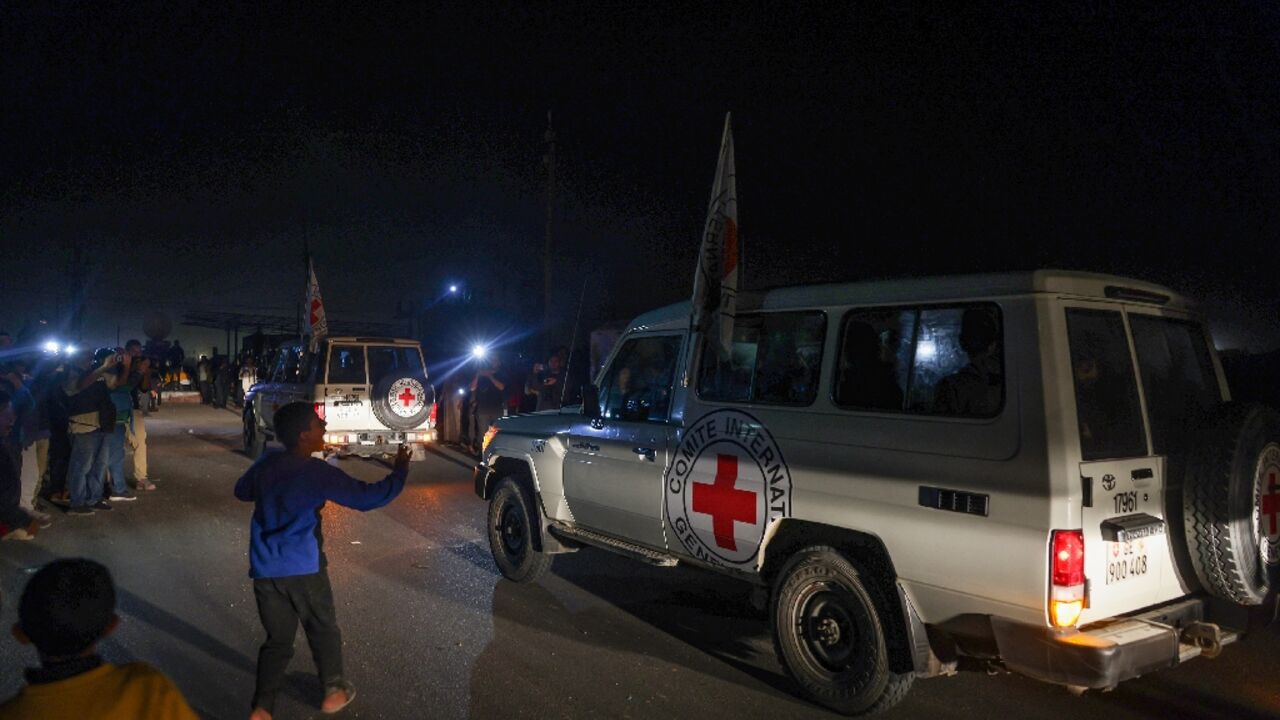 Red Cross jeeps reportedly carrying Israeli hostages cross the Rafah border point between Gaza and Egypt