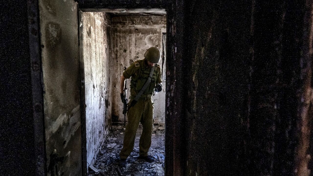The stench of death still pervades charred homes more than a month after Israel's Kfar Aza was stormed by Hamas gunmen