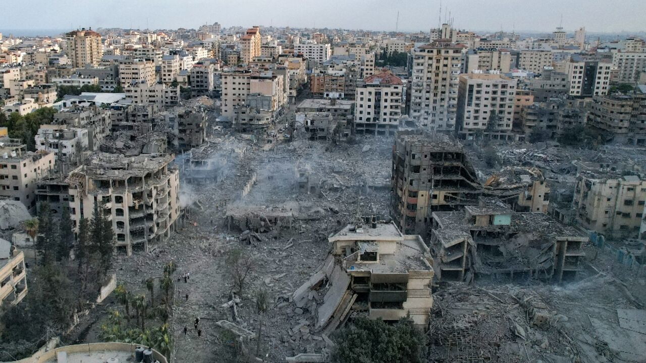 This aerial photo show heavily damaged buildings following Israeli airstrikes in Gaza City