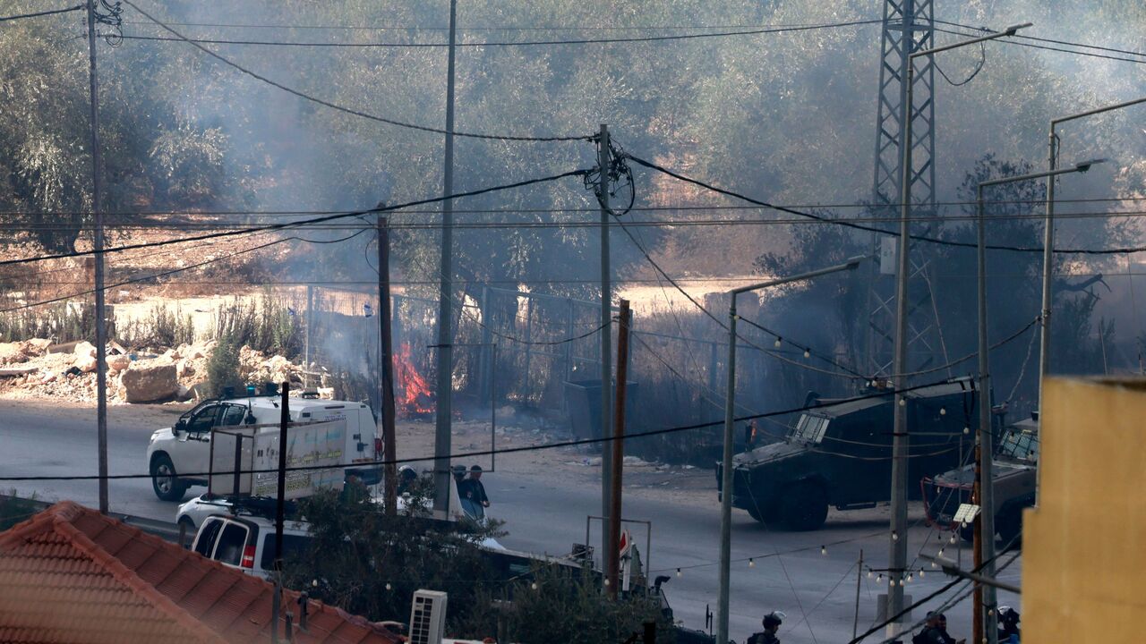 Israeli soldiers are seen in the Palestinian village of Dayr Sharaf, in the West Bank located about seven kilometres (four miles) from the Jewish Einav settlement after an Israeli man was killed leading to dozens of Jewish settlers storming the village on November 2, 2023, amid the ongoing battles between Israel and the Palestinian group Hamas in the Gaza Strip. Three Palestinians were killed on November 2, 2023, by Israeli fire in the occupied West Bank, the Palestinian health ministry said, and an Israeli