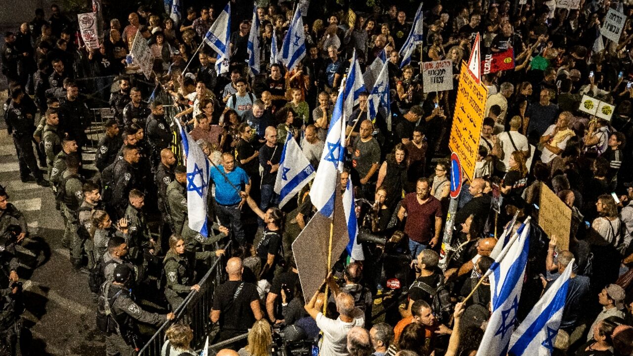 Security forces block a march by Israelis protesting the hard-right government's lack of preparedness for the October 7 attacks and its handling of the ensuing hostage crisis