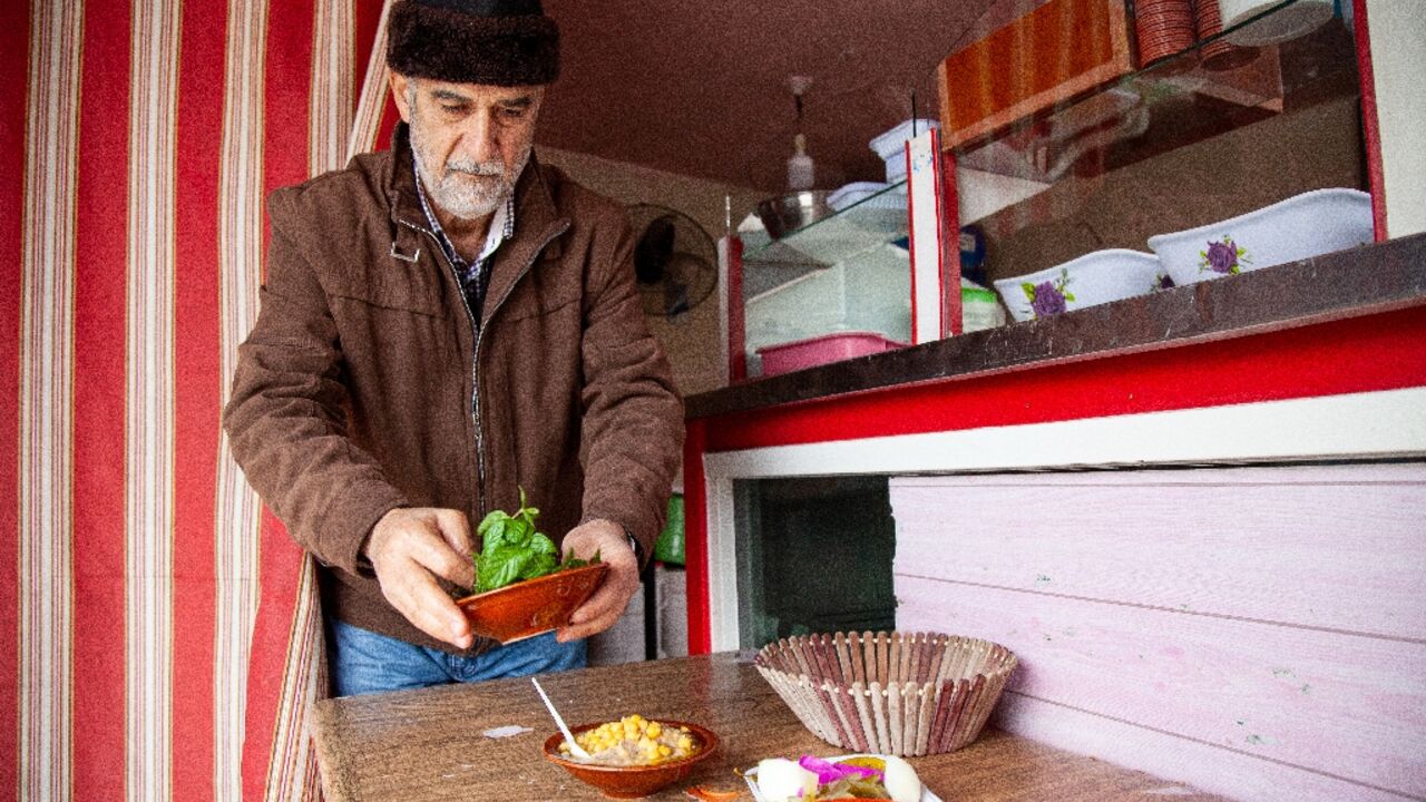 Hussein Murtada says he works 'under the bombs' to prepare falafel in his village near the Israeli border