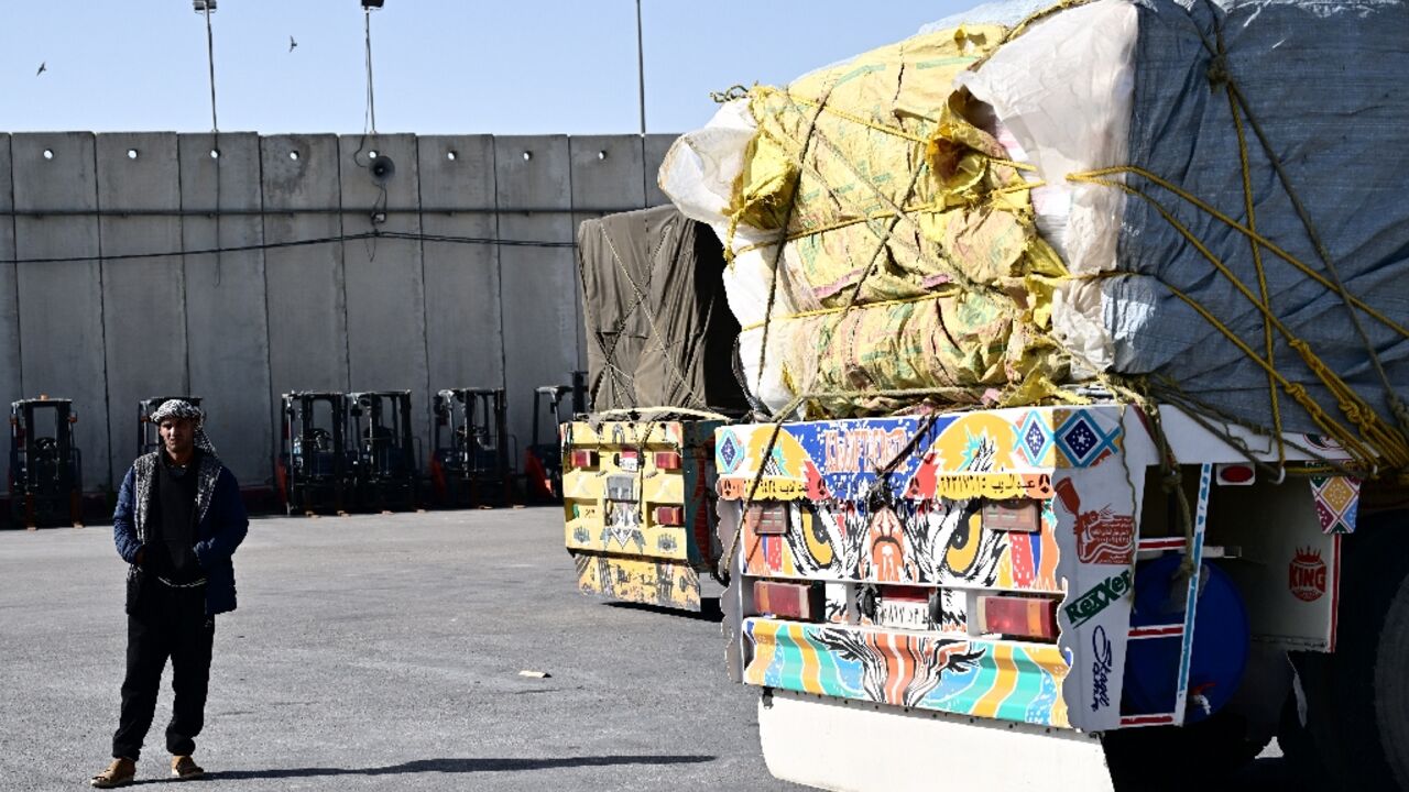 Egyptian drivers carrying aid to Gaza wait for hours at a recently reopened border crossing