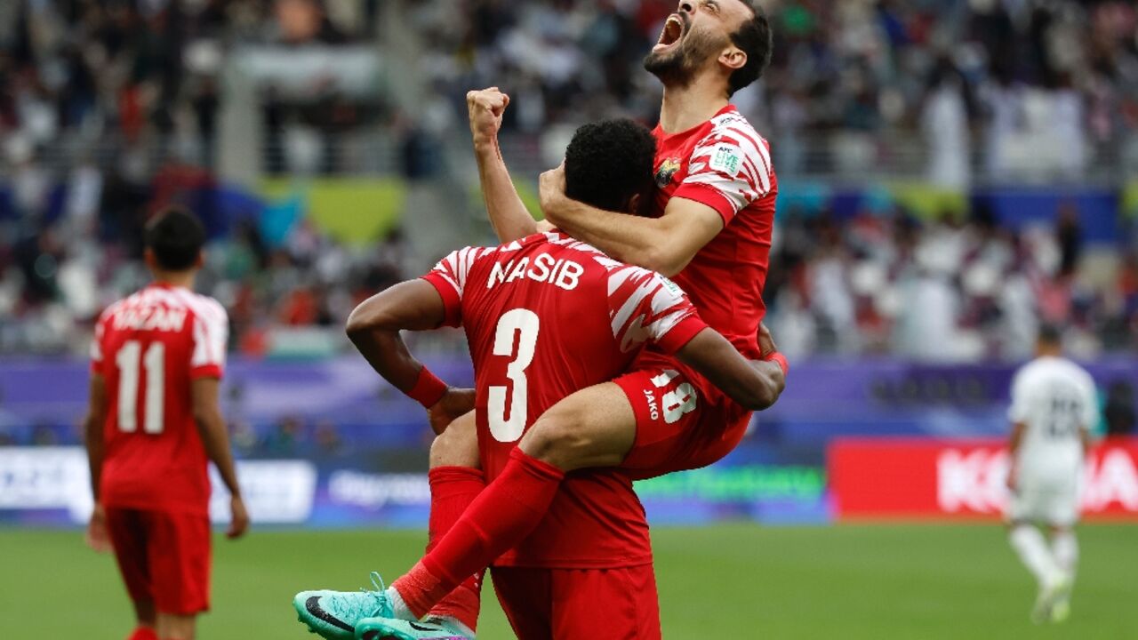 Jordan's players celebrate their equaliser, but even better was to come