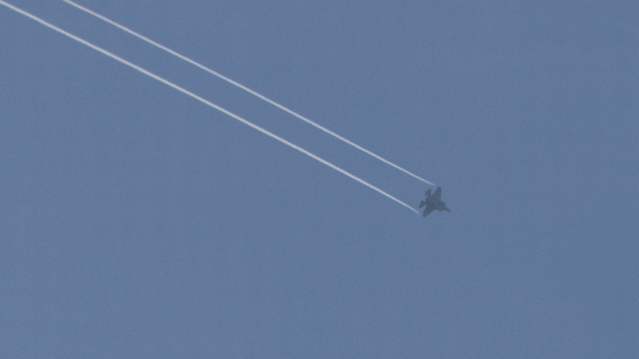 A picture taken from Israel's southern city of Sderot shows a US-made Israeli F-35 jet over the northern Gaza Strip; aid groups have called on countries to stop providing weapons to Israel and Palestinian armed groups