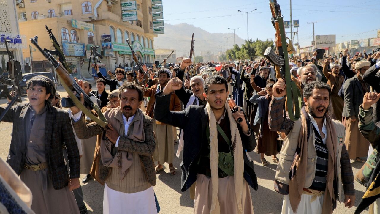 Armed demonstrators take part in a solidarity rally with Gaza in the rebel-held Yemeni capital Sanaa