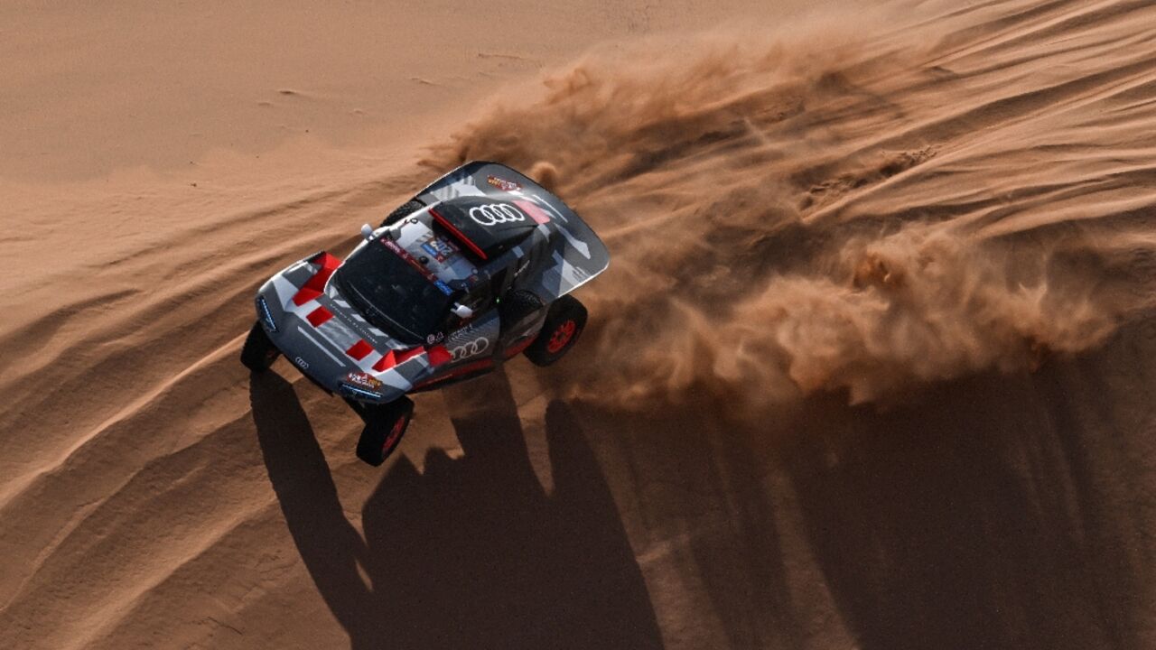 Sand man: Stephane Peterhansel en route to a record-equalling 50th Dakar stage win 