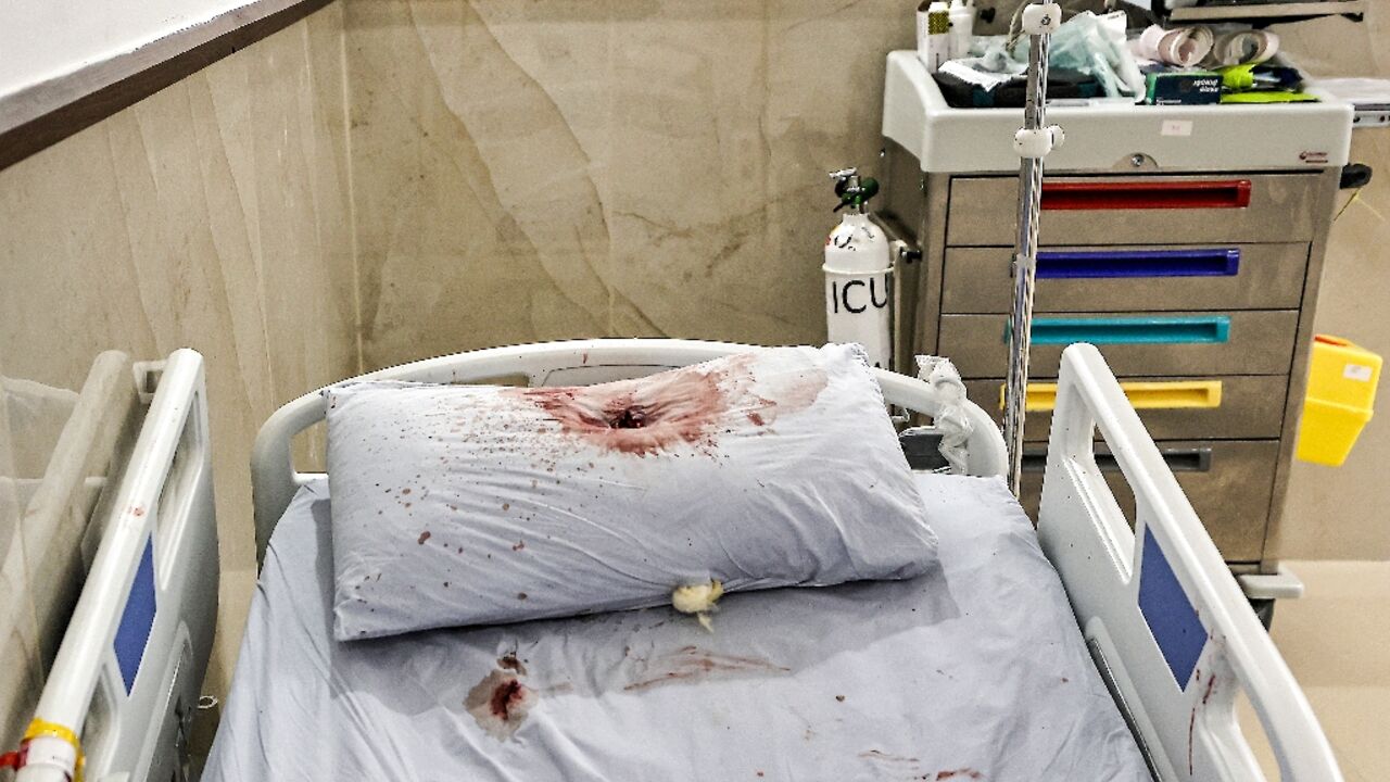 A bullet hole is visible in the blood-soaked pillow of a hospital bed  after a deadly raid by Israeli undercover agents on the Ibn Sina Hospital in the West Bank city of Jenin