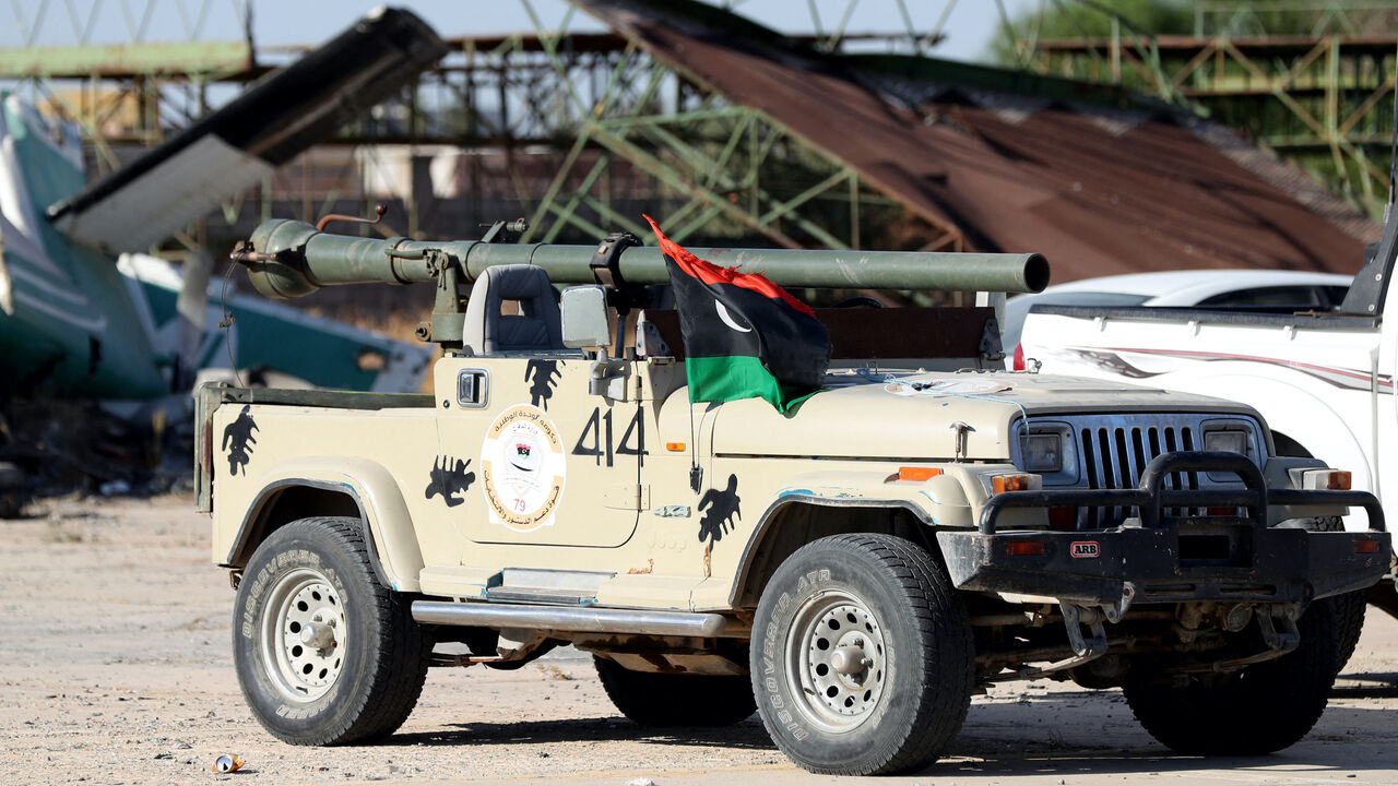 Joint forces affiliated with Libya's Government of National Unity assemble inside the closed Tripoli International Airport, as they deploy on the outskirts and entrances of the capital Tripoli on July 25, 2022. - At least 16 people were killed and 52 wounded in fighting between armed groups in Tripoli, the health ministry said on July 23, following the latest politically driven violence to hit the Libyan capital. (Photo by Mahmud Turkia / AFP) (Photo by MAHMUD TURKIA/AFP via Getty Images)