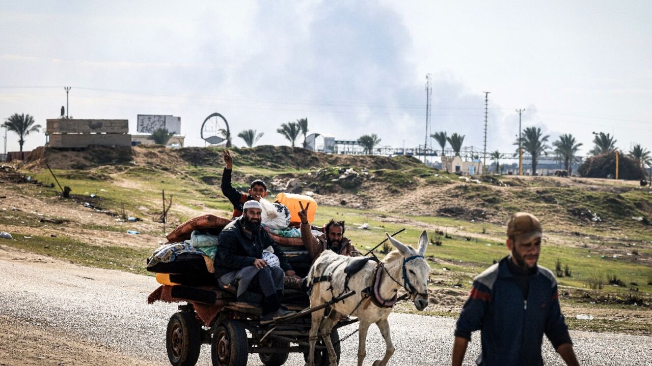 Palestinians flee Khan Yunis toward Rafah further south in the Gaza Strip as Israel bombards the city