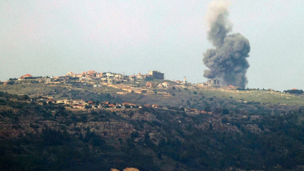 Smoke billowing over the Lebanese village of Markaba, near the Israeli border, following reported strikes