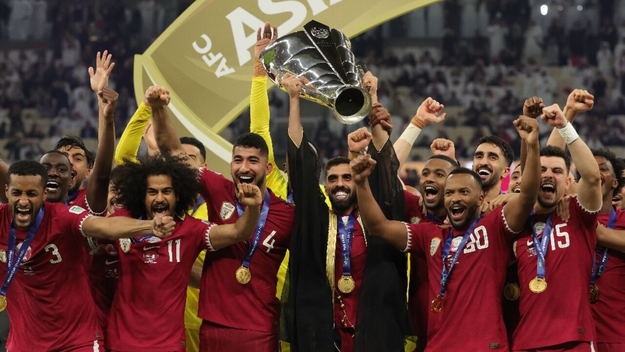 Hassan Al-Haydos lifts the Asian Cup for Qatar after the host nation beat Jordan in the final