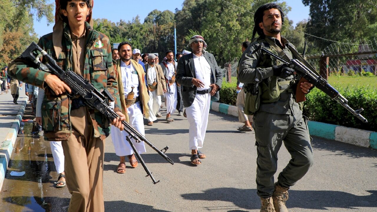 Armed supporters of Yemen's Huthi rebels attend a rally in Sanaa on February 1, 2024