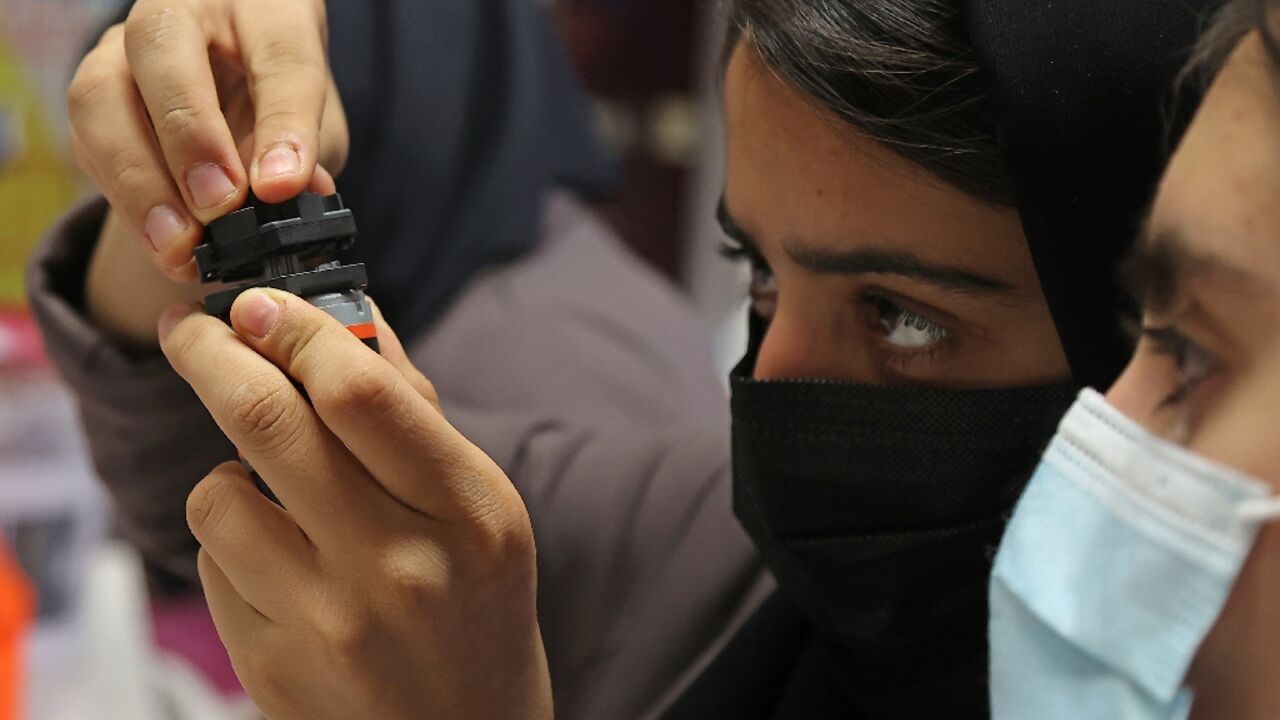 Members of an all-girl Afghan robotics team who fled the Taliban continue their studies in 2021 at the Qatar campus of Texas A&M, which the US university has announced will now close