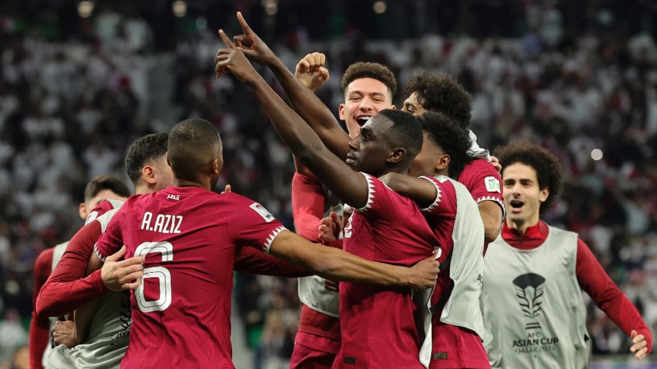 Almoez Ali (C) celebrates with his Qatar teammates after scoring the winner