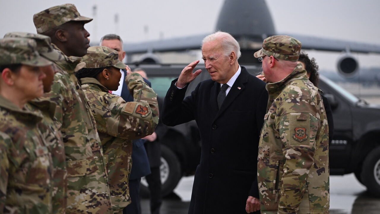 US President Joe Biden greets military personnel on arrival at Dover Air Force Base in Dover, Delaware, on Feb. 2, 2024, to attend the transfer of the remains of three US service members killed in the drone attack on the US military outpost in Jordan. 