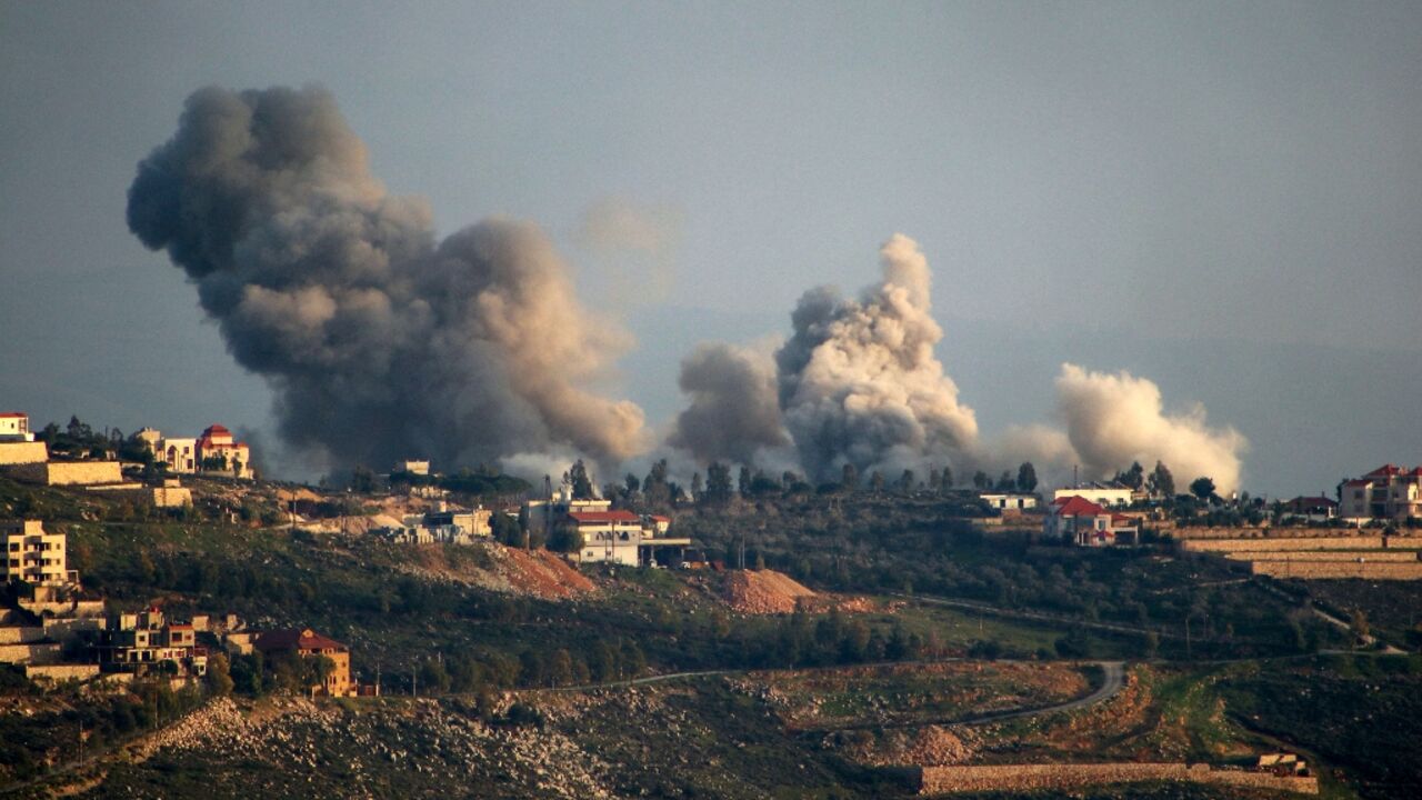 Smoke billows over the south Lebanon border village of Khiam where Israeli strikes have killed a civilian