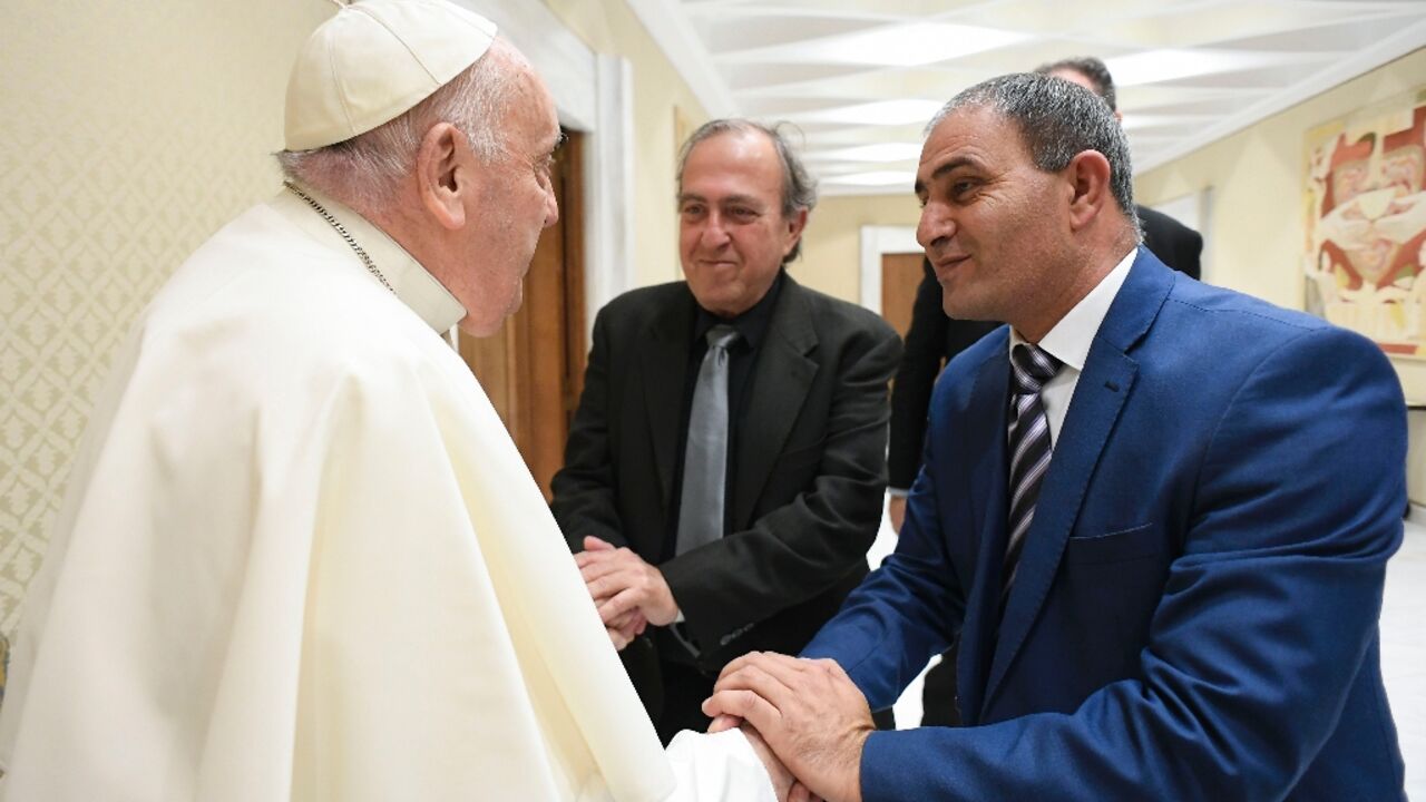 Handout photo from the Vatican showing Pope Francis meeting with Palestinian Bassam Aramin and Israeli Rami Elhanan, who both lost their daughters to violence in the Middle East