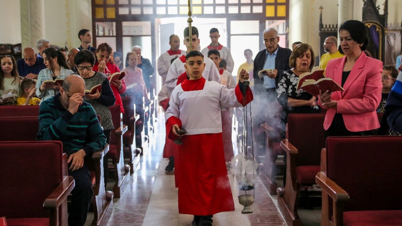 Members of the tiny Catholic community in Gaza celebrate a grim Easter in the war-ravaged territory where famine looms