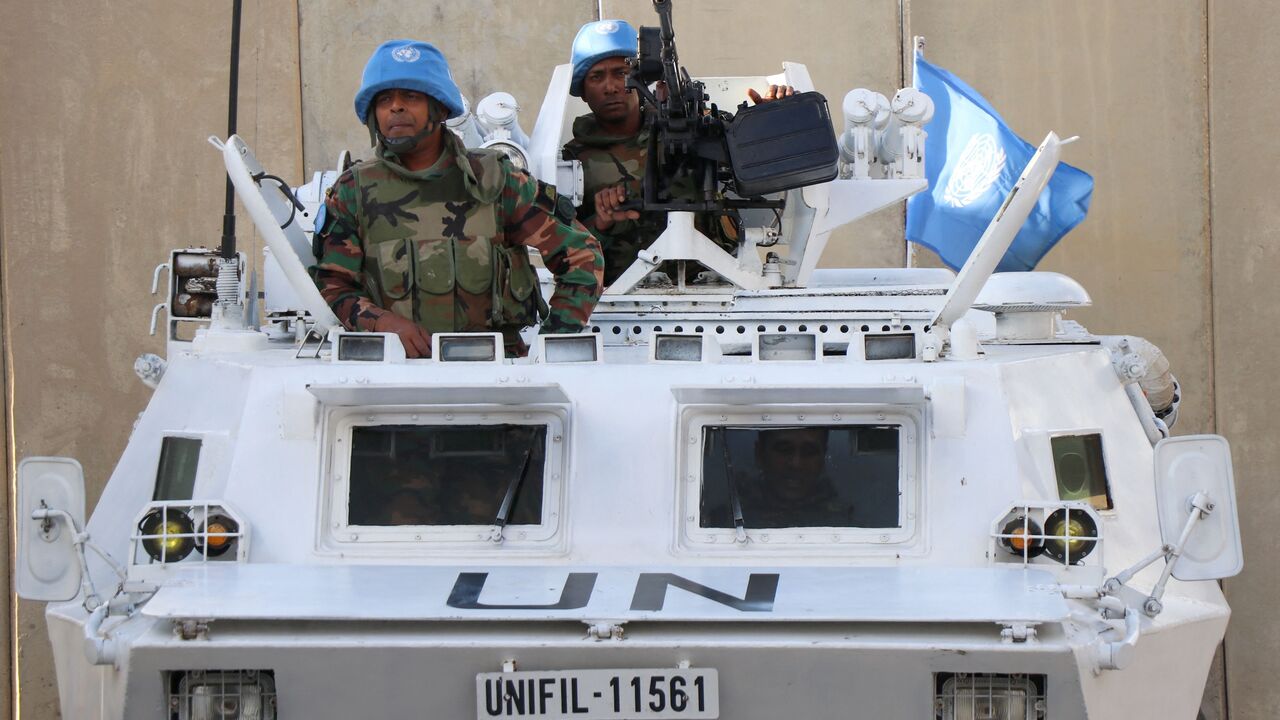 Peacekeepers of the United Nations Interim Force in Lebanon (UNIFIL) man their armored vehicle in the southern Lebanese town of Naqoura, near the border with Israel, Oct. 15, 2023. 